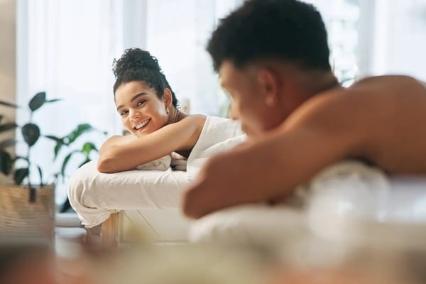 Couple relaxing side by side during a customized massage at Wellbeing Spa